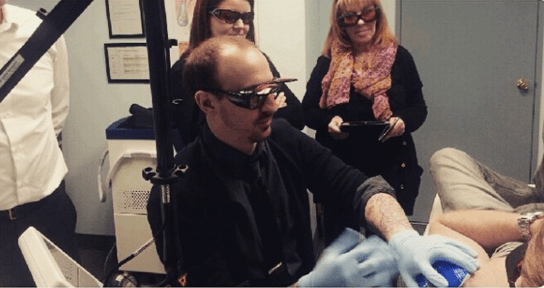 IBI students take part in a tattoo removal demo