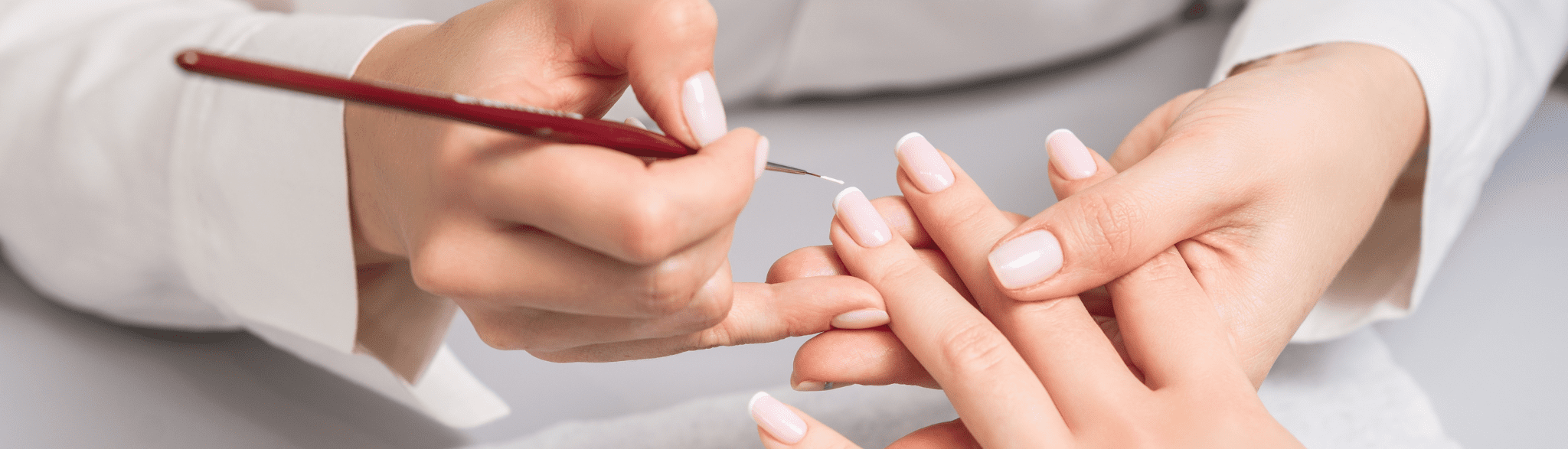 A Woman In A Nail Salon Receiving A Manicure