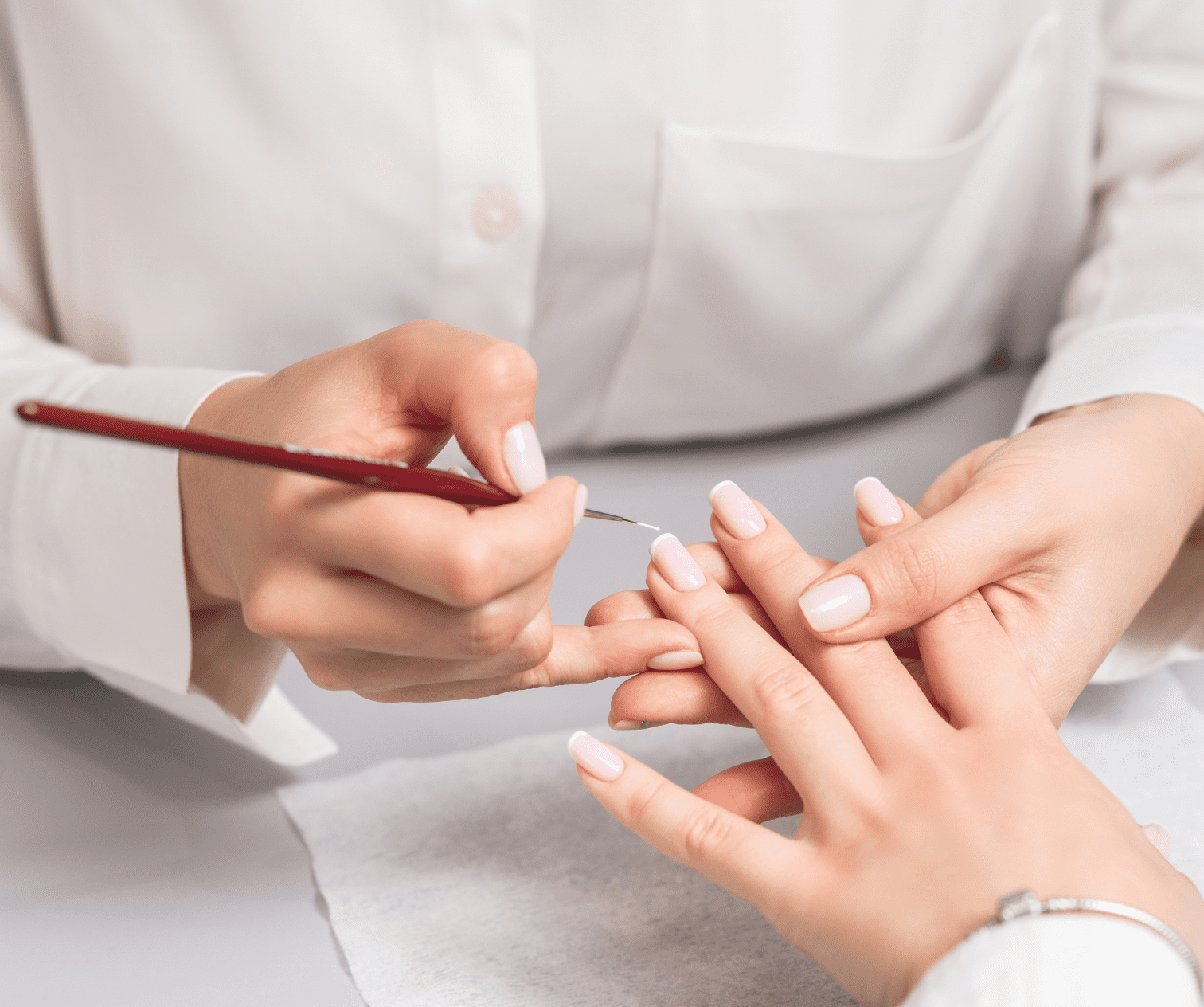 A Woman In A Nail Salon Receiving A Manicure