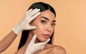 Woman receiving a skin analysis from a medical aesthetician.