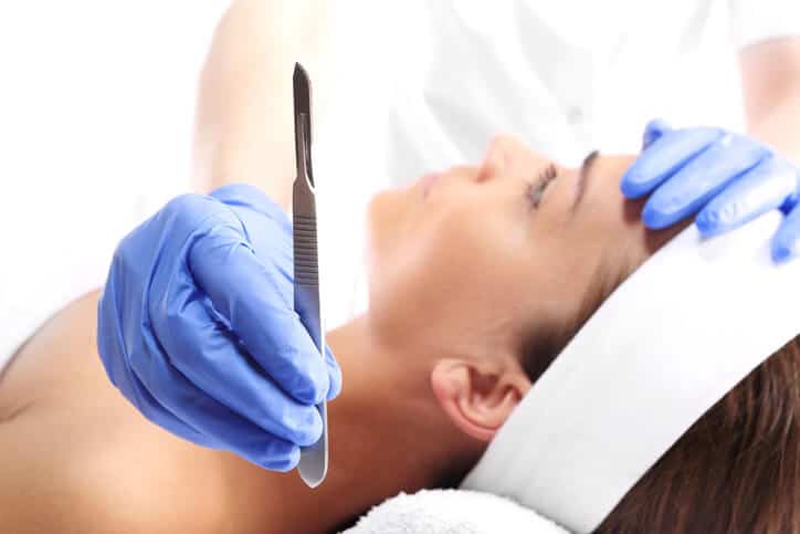 A scalpel handle and blade is the primary tool for dermaplaning.